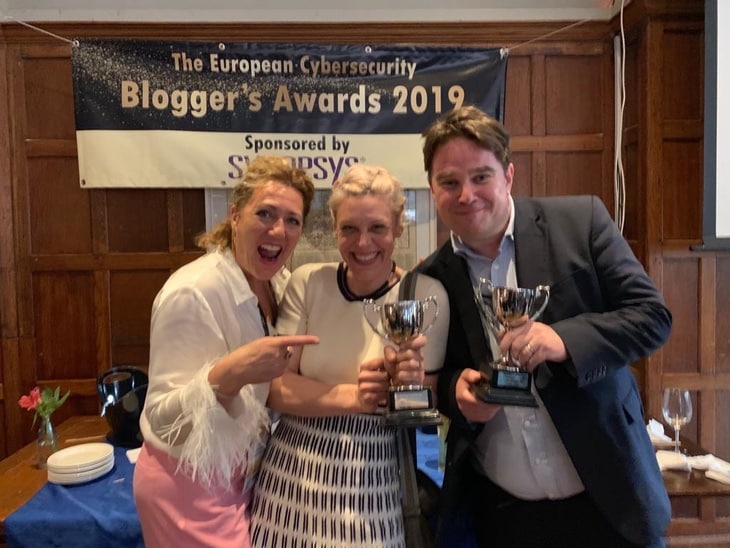 Yvonne Eskenzi (left) presenting awards to Carole Theriault and Graham Cluley